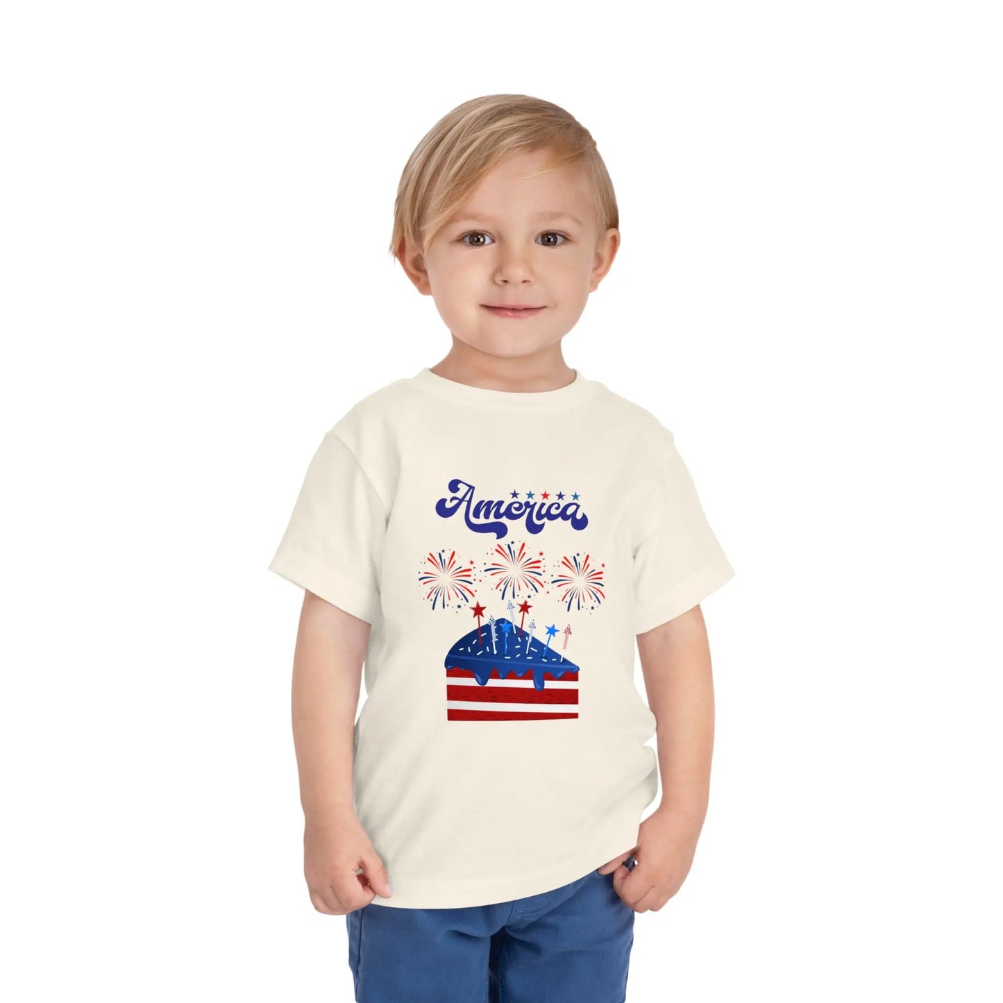 Celebrate Independence Day in style! Soft, print-on-demand 4th of July toddler tee featuring a festive flag cake and fireworks design. Sizes 2T–5T. Natural