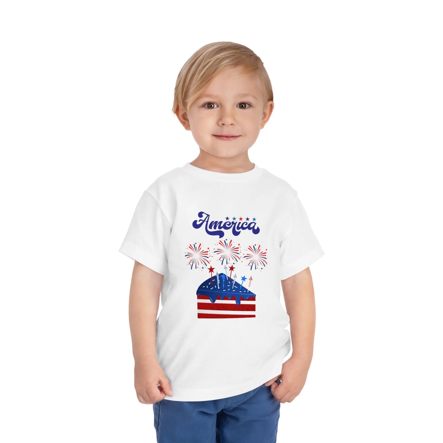 Celebrate Independence Day in style! Soft, print-on-demand 4th of July toddler tee featuring a festive flag cake and fireworks design. Sizes 2T–5T. White