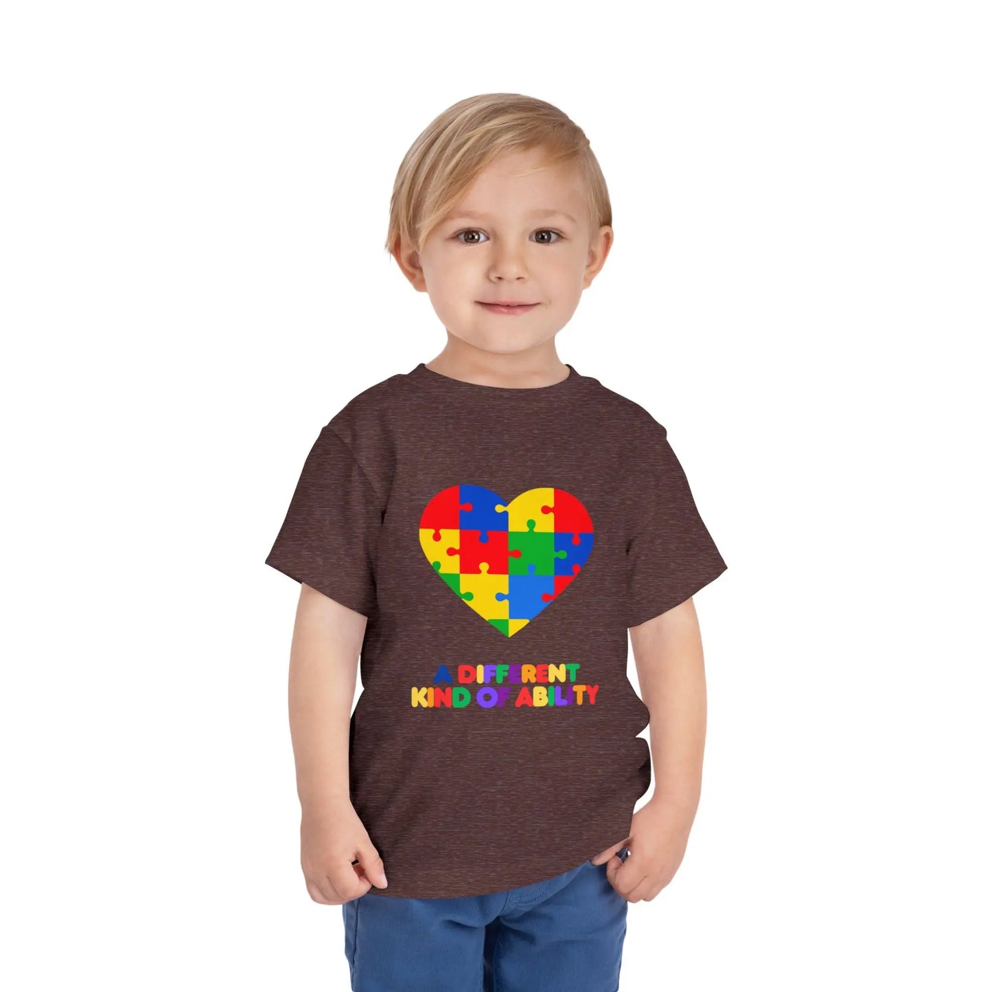 Toddler wearing an Autism Awareness t shirt honoring neurodiversity with this "A Different Kind of Ability" autism awareness toddler tee. Featuring a puzzle heart design, it's a meaningful shirt for little ones. Heather Maroon