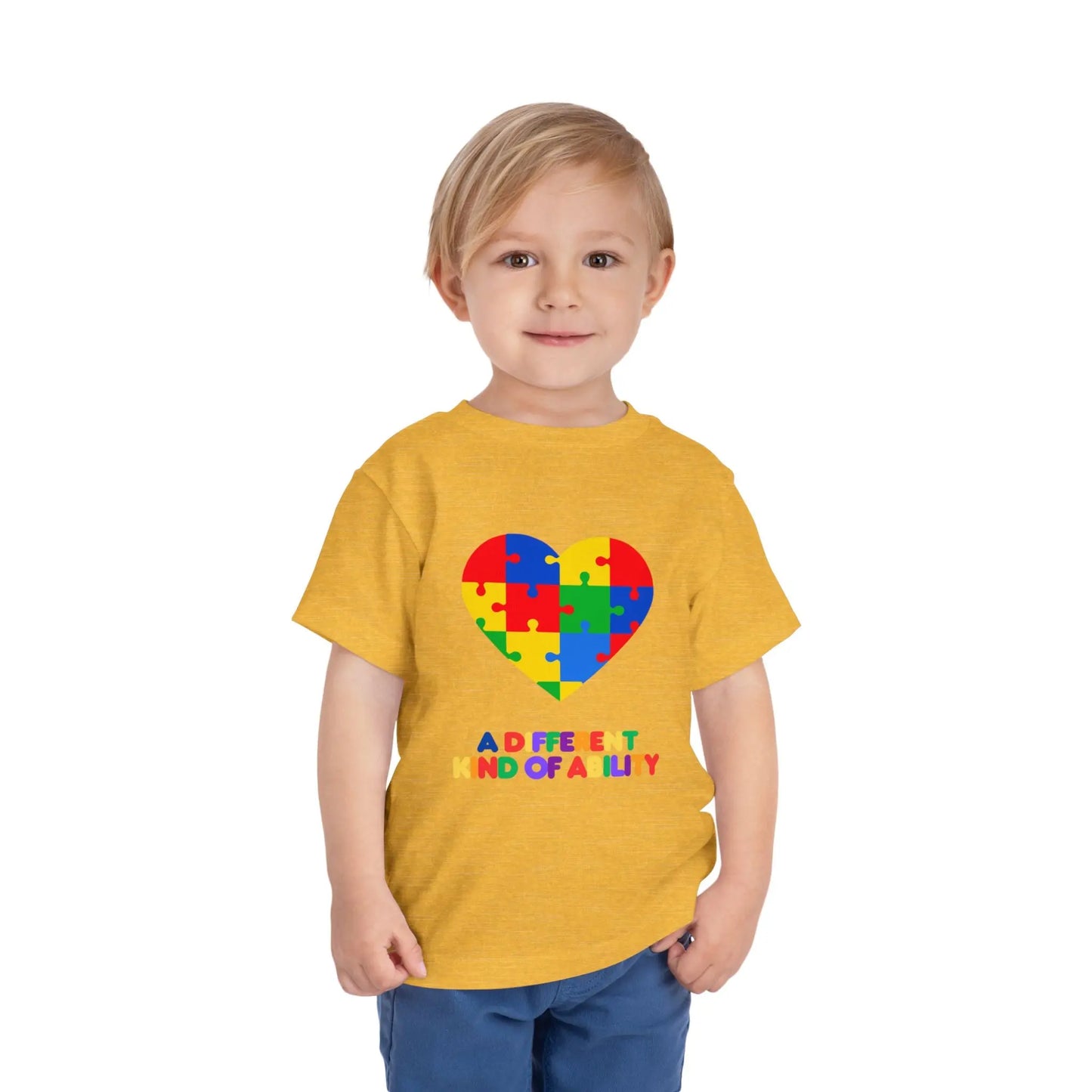 Toddler wearing an Autism Awareness t shirt honoring neurodiversity with this "A Different Kind of Ability" autism awareness toddler tee. Featuring a puzzle heart design, it's a meaningful shirt for little ones. Heather Yellow Gold