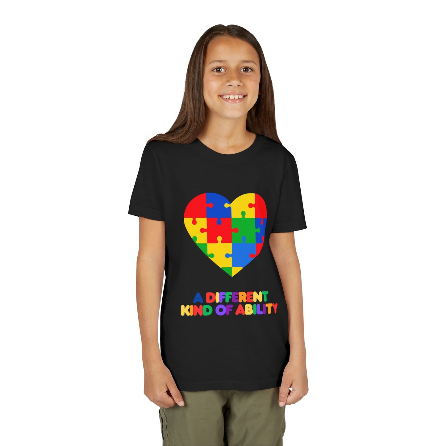 Young girl wearing an Autism Awareness Shirt. Celebrate every unique mind with this "A Different Kind of Ability" autism awareness youth tee. A puzzle heart design that spreads acceptance, love, and neurodiversity, Black