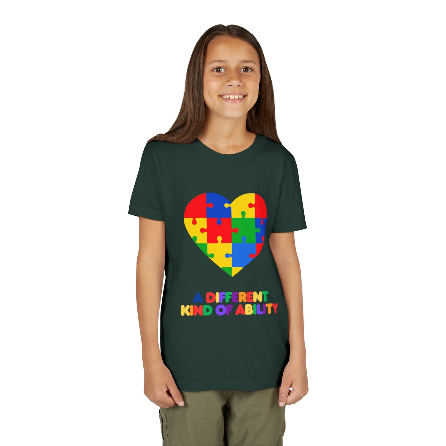 Young girl wearing an Autism Awareness Shirt. Celebrate every unique mind with this "A Different Kind of Ability" autism awareness youth tee. A puzzle heart design that spreads acceptance, love, and neurodiversity, Forest