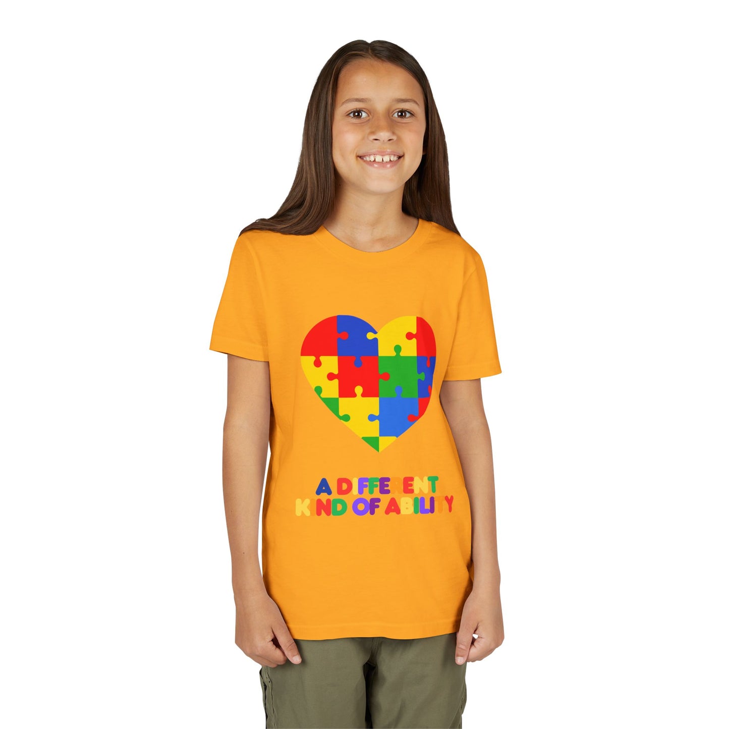 Young girl wearing an Autism Awareness Shirt. Celebrate every unique mind with this "A Different Kind of Ability" autism awareness youth tee. A puzzle heart design that spreads acceptance, love, and neurodiversity, Gold