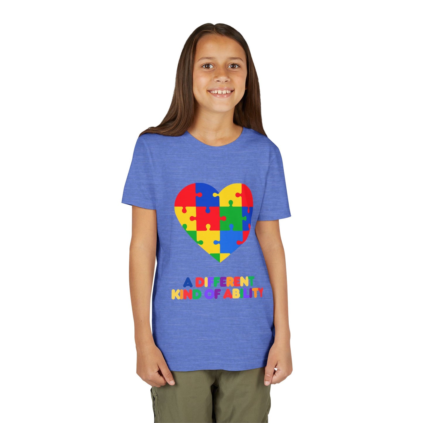 Young girl wearing an Autism Awareness Shirt. Celebrate every unique mind with this "A Different Kind of Ability" autism awareness youth tee. A puzzle heart design that spreads acceptance, love, and neurodiversity, Heather Columbia Blue
