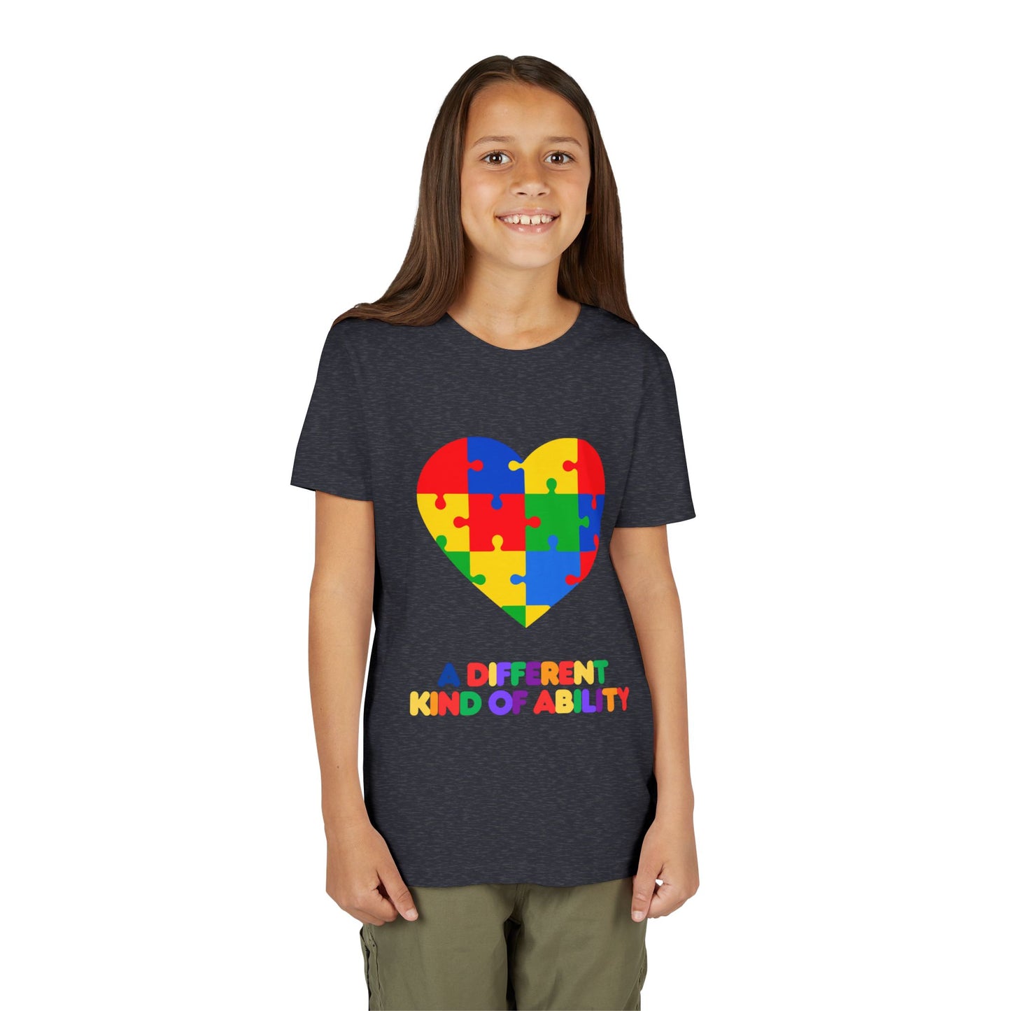 Young girl wearing an Autism Awareness Shirt. Celebrate every unique mind with this "A Different Kind of Ability" autism awareness youth tee. A puzzle heart design that spreads acceptance, love, and neurodiversity, Heather Navy