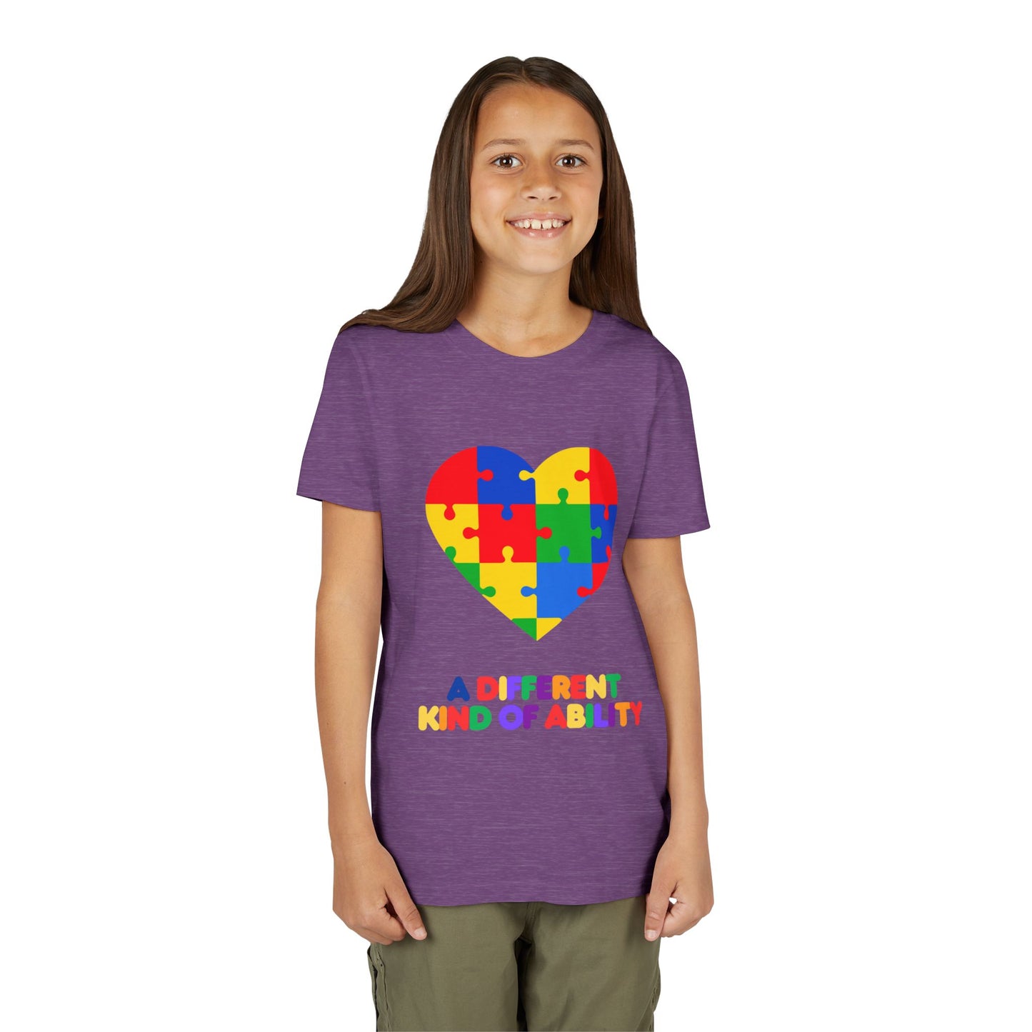 Young girl wearing an Autism Awareness Shirt. Celebrate every unique mind with this "A Different Kind of Ability" autism awareness youth tee. A puzzle heart design that spreads acceptance, love, and neurodiversity, Heather Team Purple