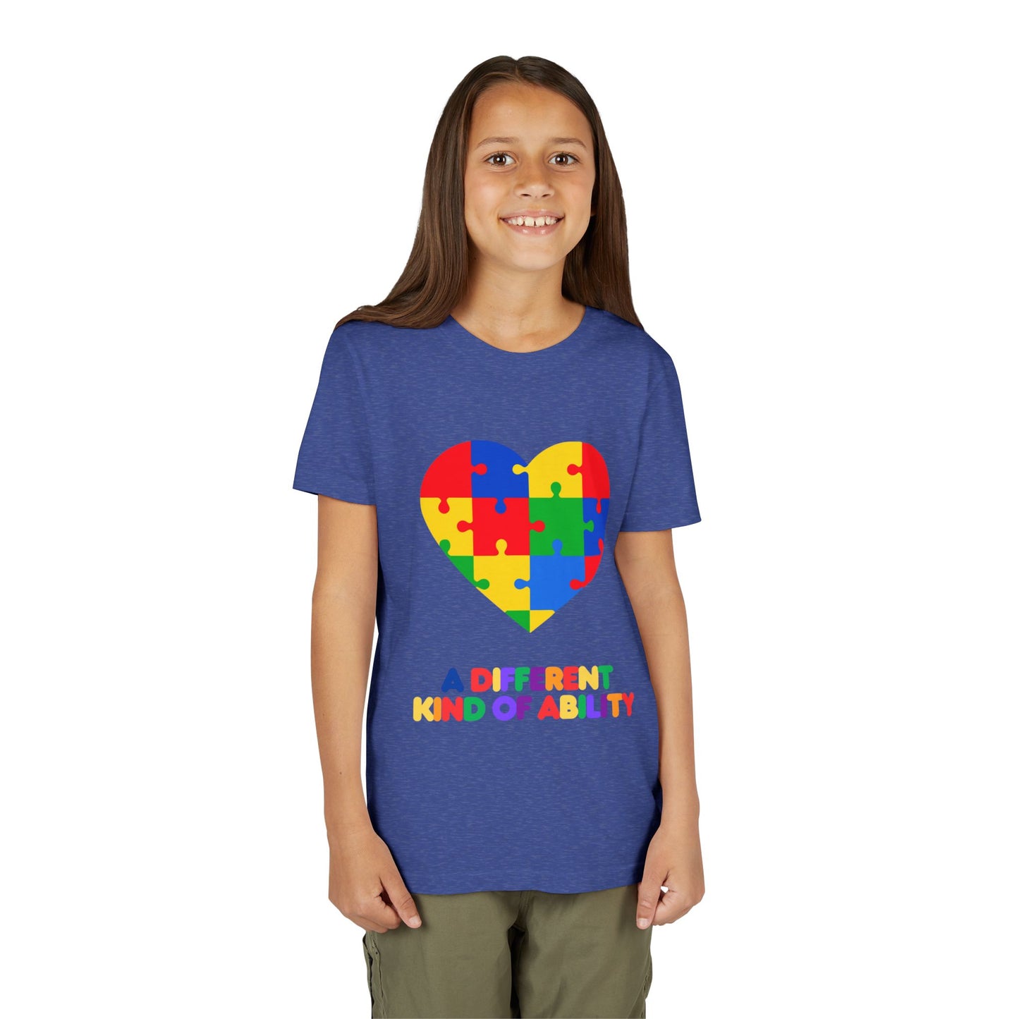 Young girl wearing an Autism Awareness Shirt. Celebrate every unique mind with this "A Different Kind of Ability" autism awareness youth tee. A puzzle heart design that spreads acceptance, love, and neurodiversity, Heather True Royal