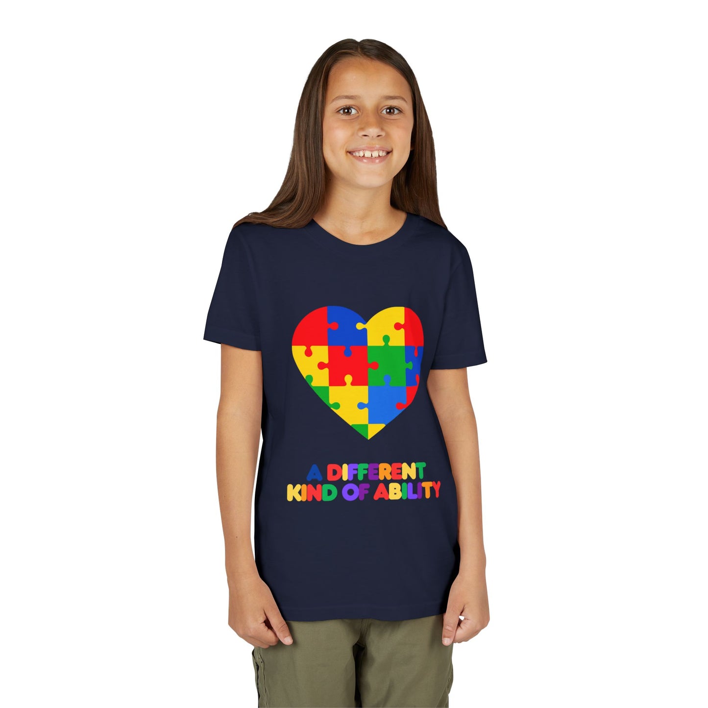 Young girl wearing an Autism Awareness Shirt. Celebrate every unique mind with this "A Different Kind of Ability" autism awareness youth tee. A puzzle heart design that spreads acceptance, love, and neurodiversity, Navy