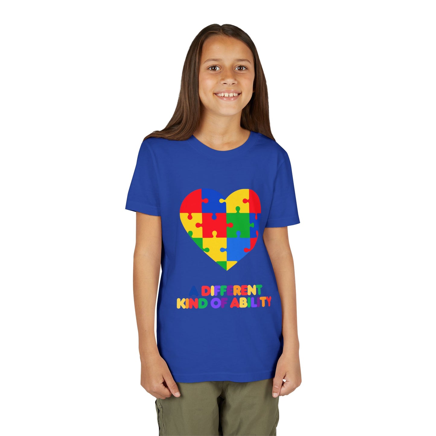 Young girl wearing an Autism Awareness Shirt. Celebrate every unique mind with this "A Different Kind of Ability" autism awareness youth tee. A puzzle heart design that spreads acceptance, love, and neurodiversity, True Royal