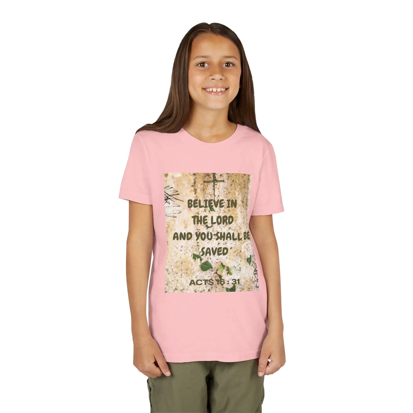 Youth wearing a soft, faith-filled youth tee featuring Acts 16:31 — "Believe in the Lord and you shall be saved." A meaningful Christian kids shirt for church, Sunday. Pink