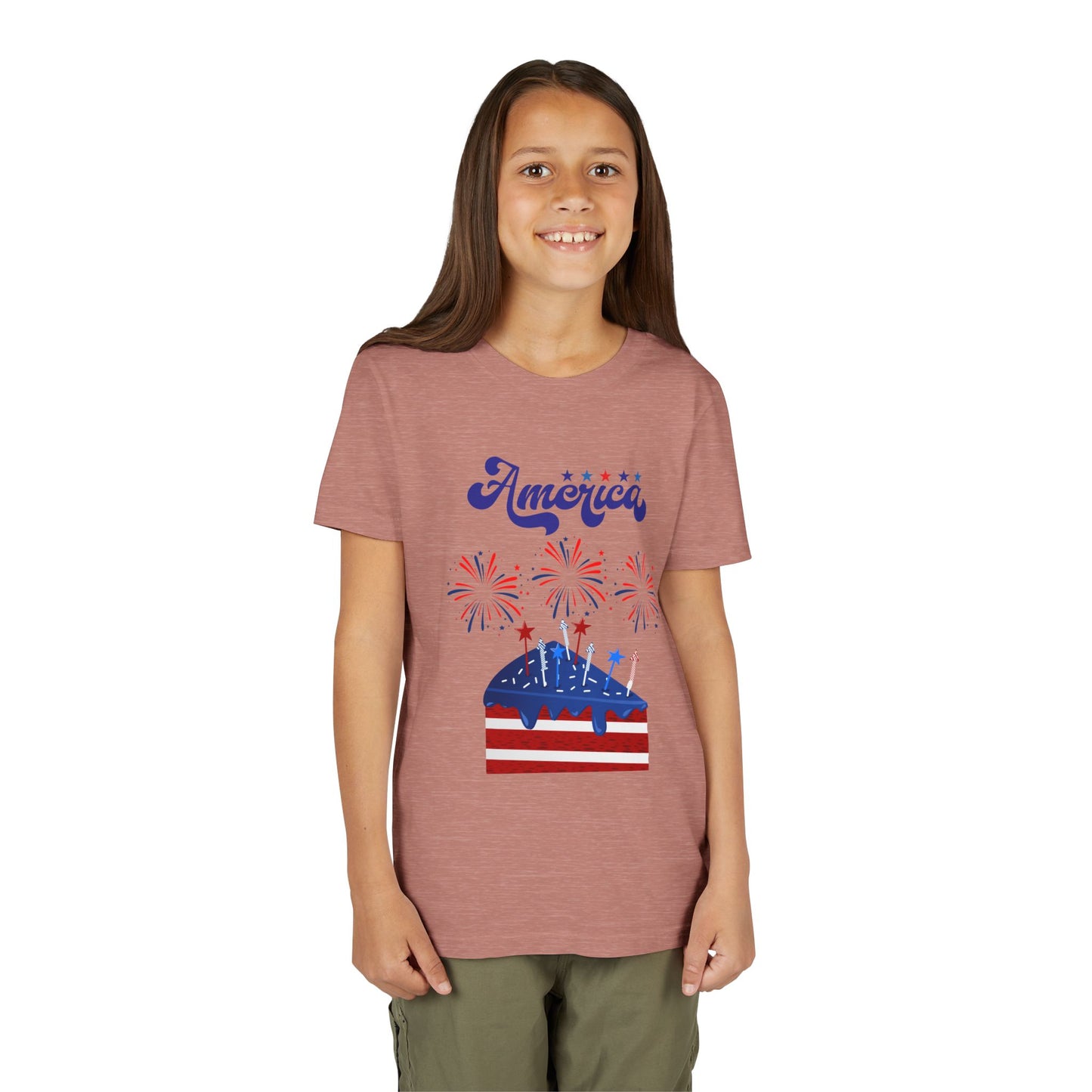 Girl wearing a t-shirt with 'America' and fireworks design on a white background. Celebrate the 4th of July in style! This patriotic America fireworks youth tee is perfect for kids who love Independence Day festivities and summer fun. Heather Mauve