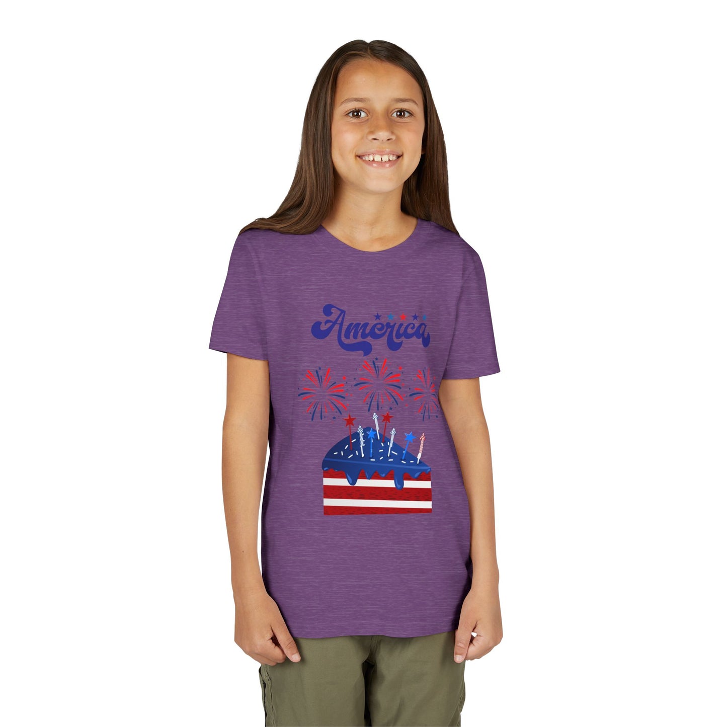 Girl wearing a Heather Team Purple t-shirt with 'America' and a cake graphic on a white background. Celebrate the 4th of July in style! This patriotic America fireworks youth tee is perfect for kids who love Independence Day festivities and summer fun.