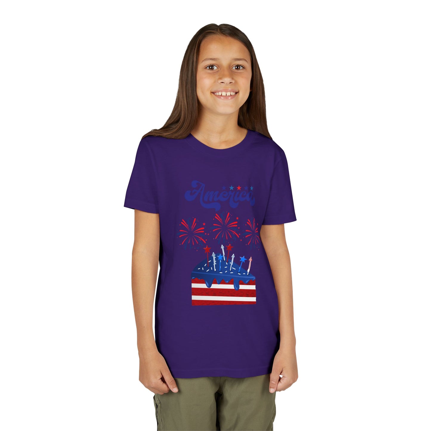 Girl wearing a Team Purple t-shirt with a graphic design on a white background. Celebrate the 4th of July in style! This patriotic America fireworks youth tee is perfect for kids who love Independence Day festivities and summer fun.