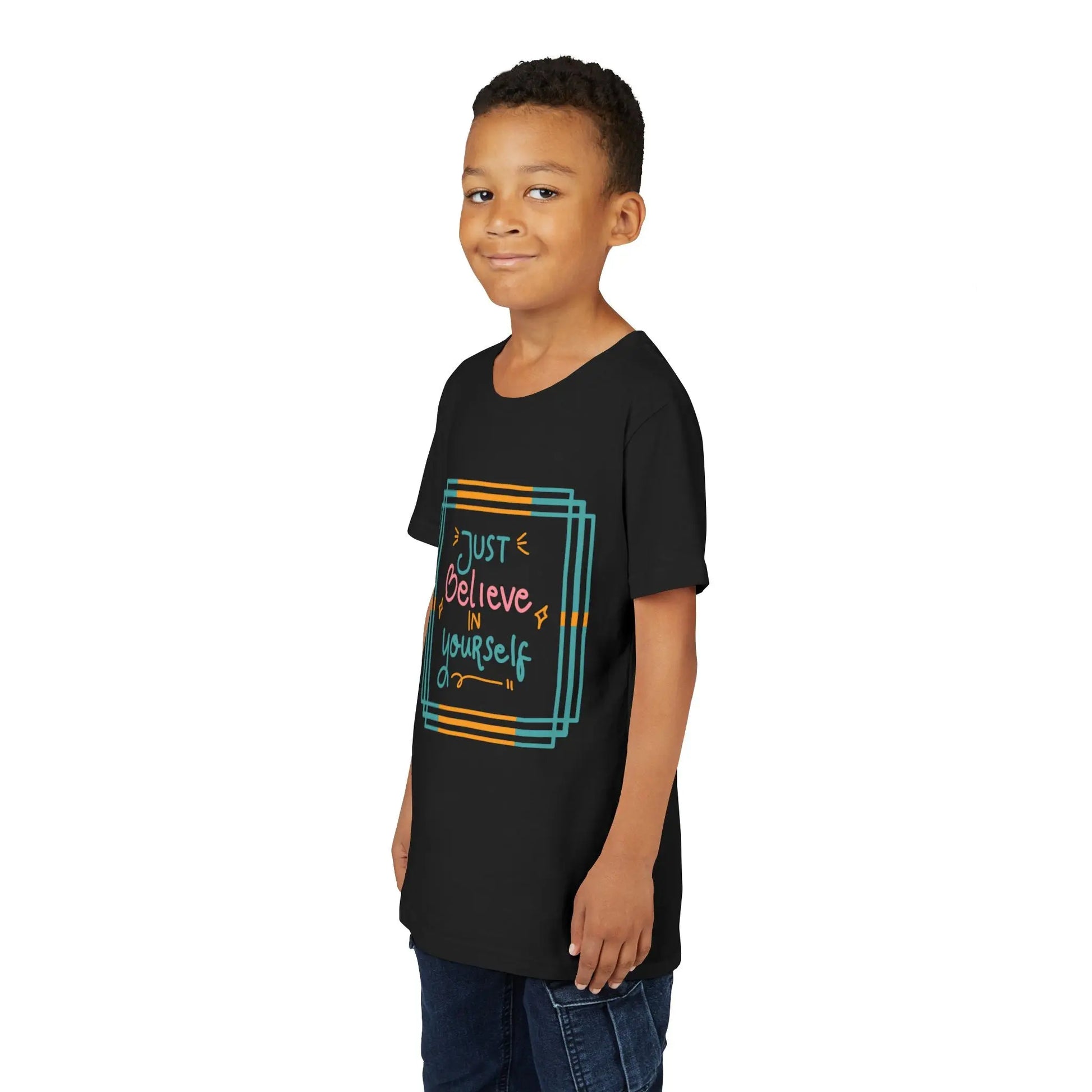 Youth wearing an encouraging youth tee with "Just Believe in Yourself" message. Soft cotton, perfect for school, everyday wear, and building confidence. Motivational kids' clothing. Black