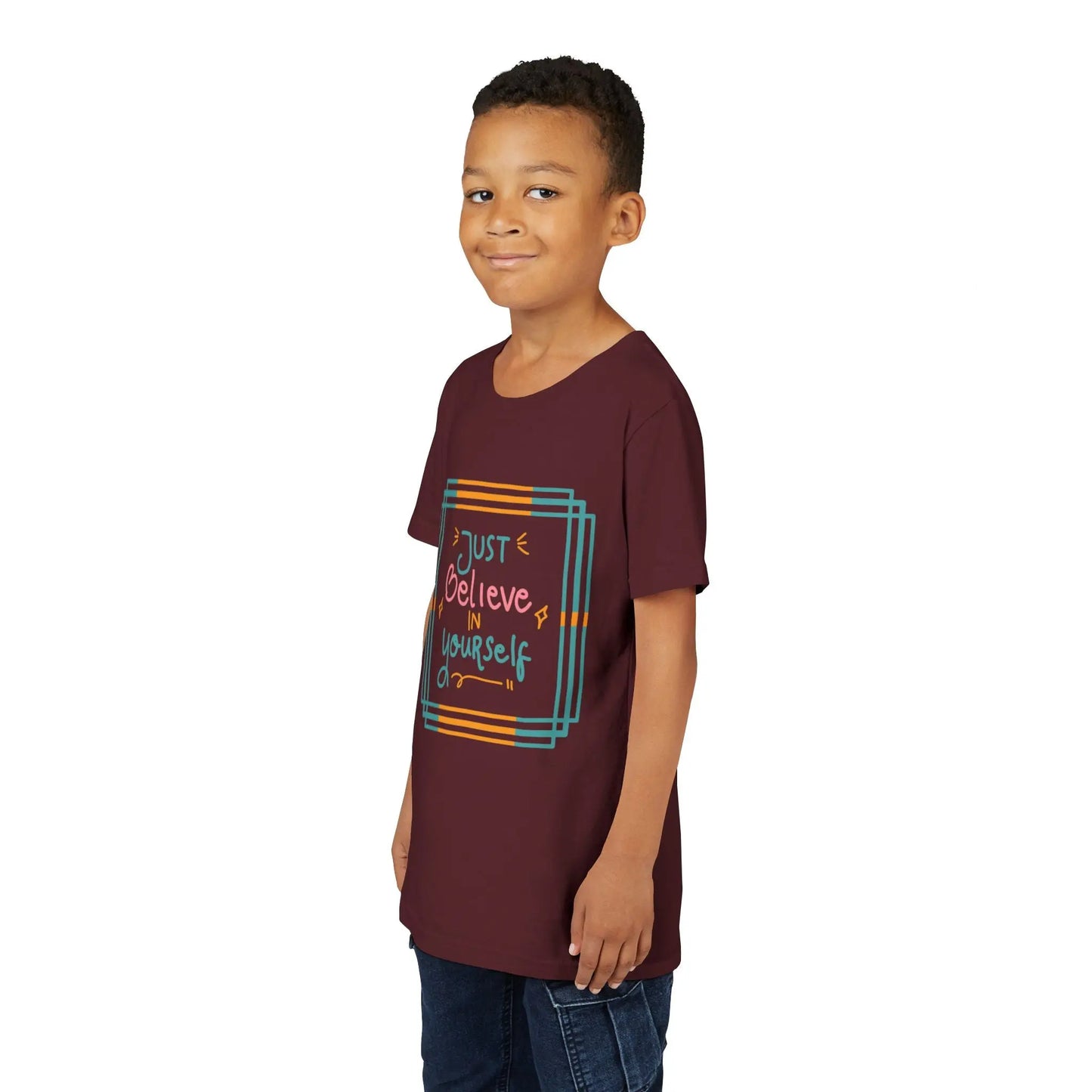 Youth wearing an encouraging youth tee with "Just Believe in Yourself" message. Soft cotton, perfect for school, everyday wear, and building confidence. Motivational kids' clothing. Maroon