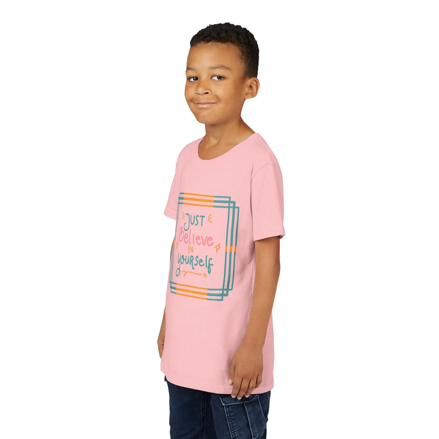 Youth wearing an encouraging youth tee with "Just Believe in Yourself" message. Soft cotton, perfect for school, everyday wear, and building confidence. Motivational kids' clothing. Pink