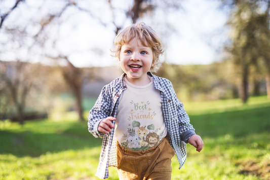 Toddler wearing this sweet toddler tee featuring bunny, fawn, and lion best friends. Soft cotton, perfect for playdates, nursery, and everyday adventures. Heather Dust