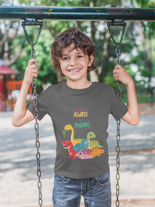 Child on a swing wearing an adorable "We'll Always Be Friends" toddler tee with colorful dinosaur friends. Perfect for dino-loving toddlers. Soft, comfortable, and playful kids' dinosaur shirt for everyday wear.