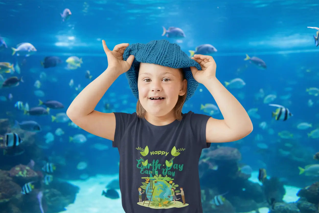 Toddler wearing Happy Earth Day tee with children tending globe and leafy accents in Navy

