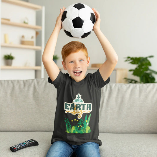 Youth wearing Earth Day tee with green leafy foliage design, Asphalt
