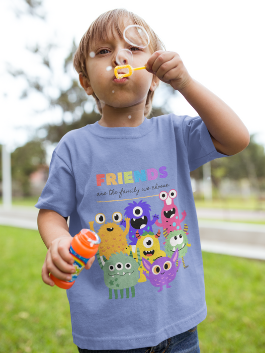 Toddler wearing colorful Friends Monster tee featuring rainbow cute monsters and "Friends are the Family We Choose" message, diversity and inclusion shirt for kids, Heather Columbia Blue
