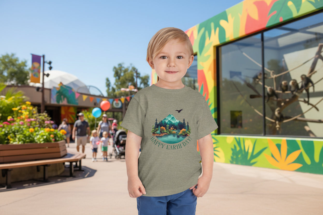 Toddler wearing Happy Earth Day tee with mountain lake and evergreen forest design, Heather Stone
