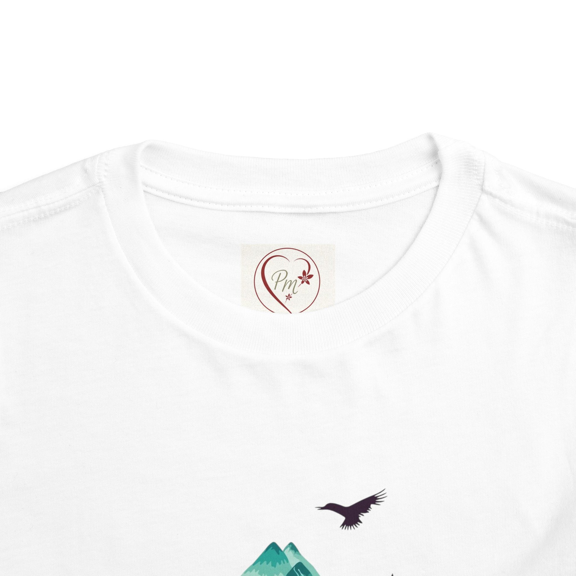 White t-shirt with a small PM Creation 25 logo on the chest and a bird design. .