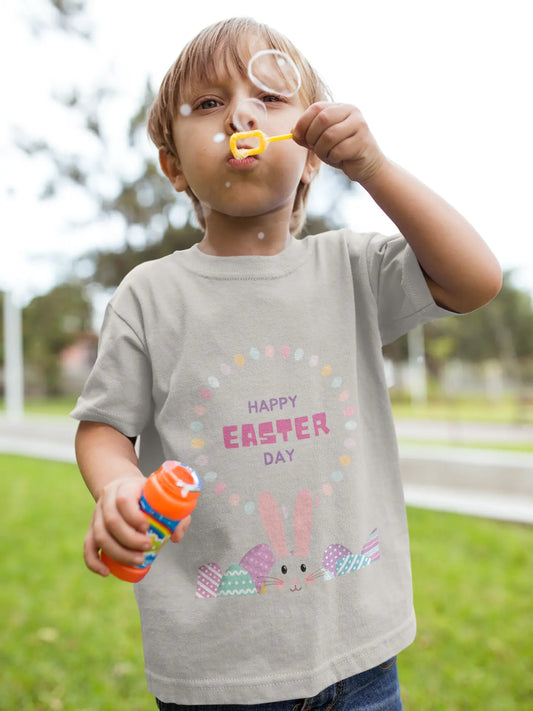 Toddler wearing Happy Easter tee with bunny and colorful eggs graphic. Heather Stone