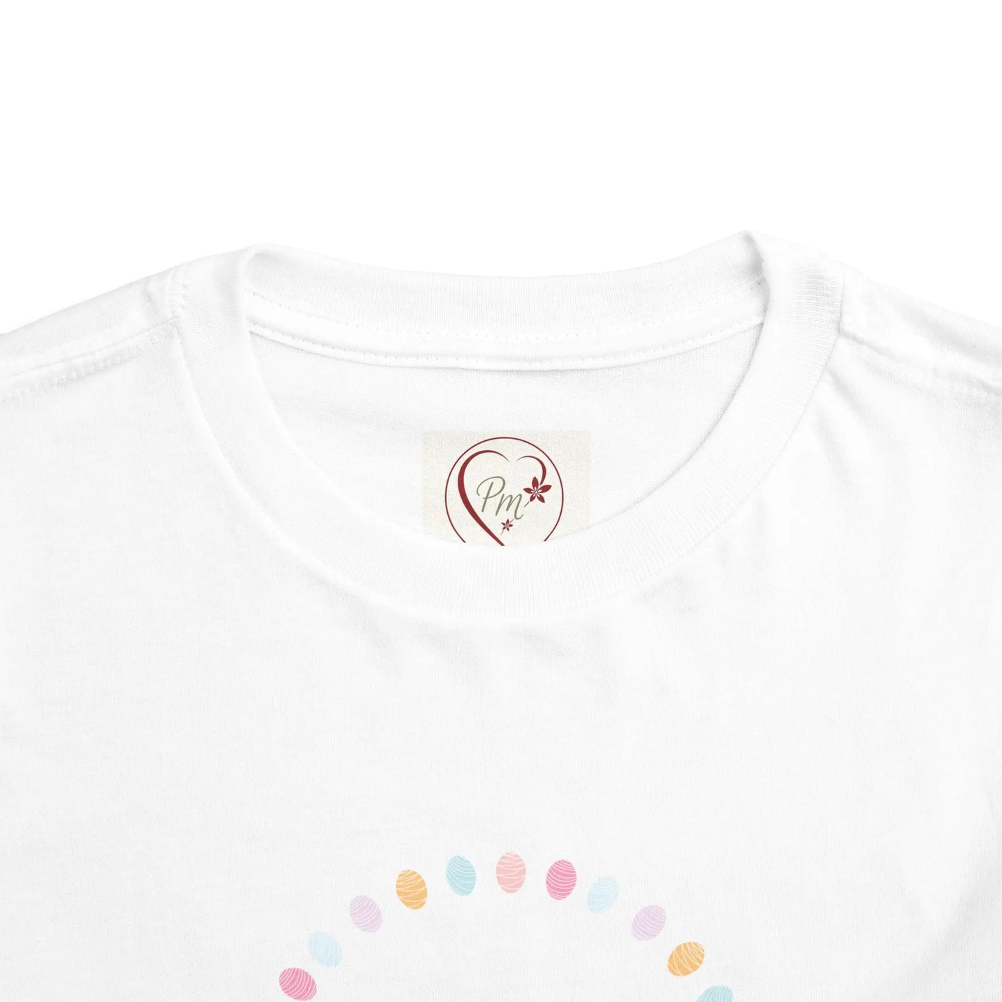 Soft cotton toddler tee perfect for Easter egg hunts, church, and spring celebrations. Cheerful bunny and egg design. Comfortable and cute. Sizes 2T-5T. Neck label, PM Creations 25 Logo