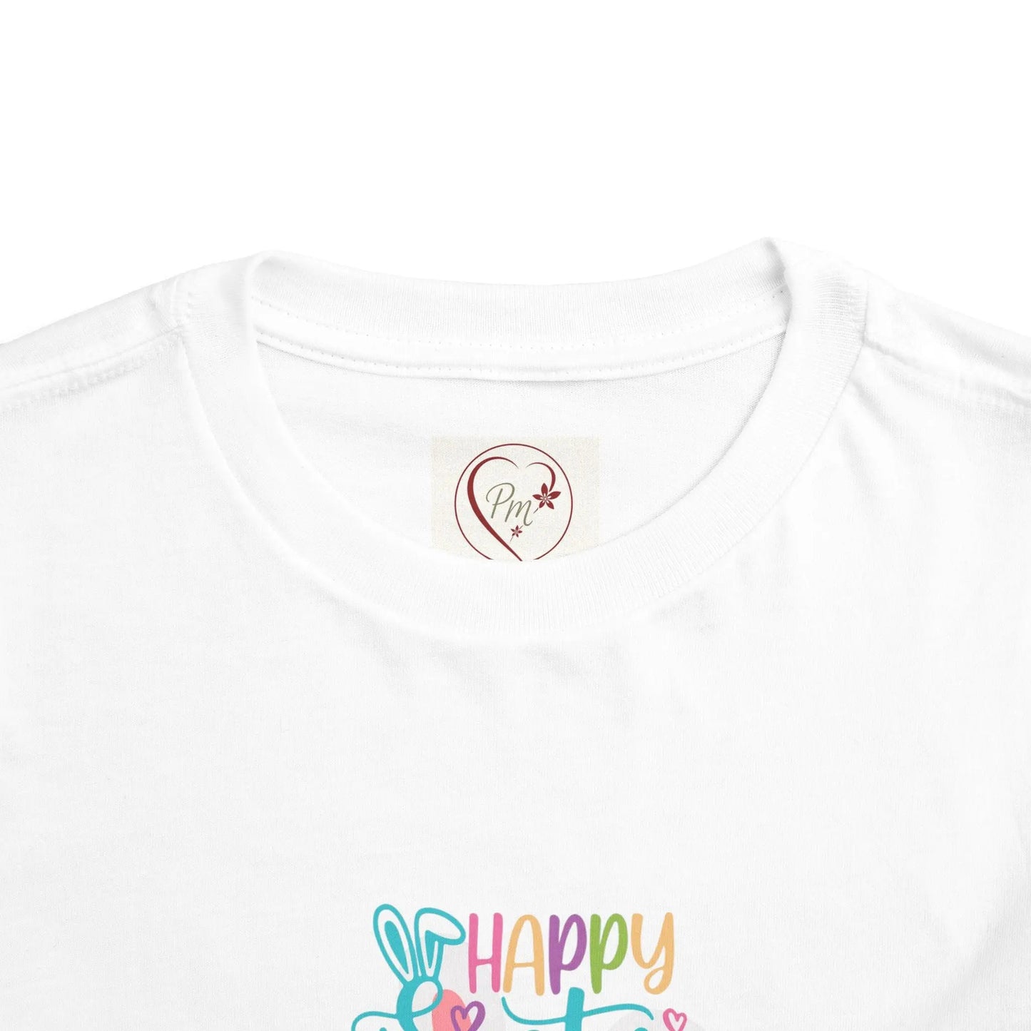 White t-shirt with colorful 'Happy Easter' design and a PM Creations 25 logo on a white background