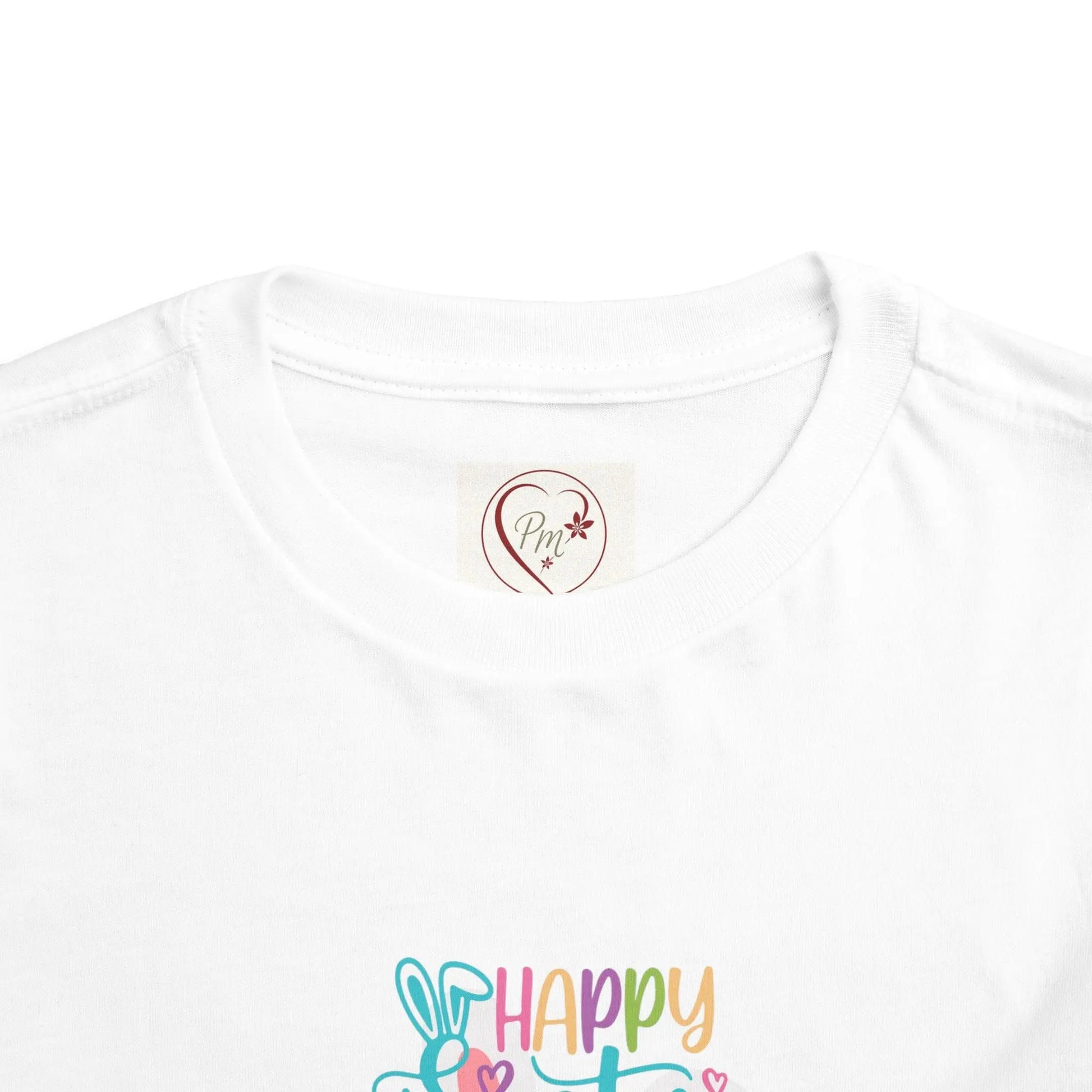 White t-shirt with colorful 'Happy Easter' design and a PM Creations 25 logo on a white background