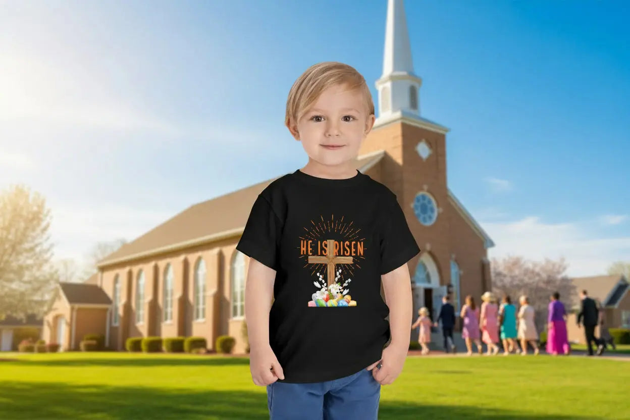 Soft toddler Easter tee with "He Is Risen" cross & pastel eggs. Perfect for church, egg hunts & family photos. Lightweight cotton for comfort & faith. Black