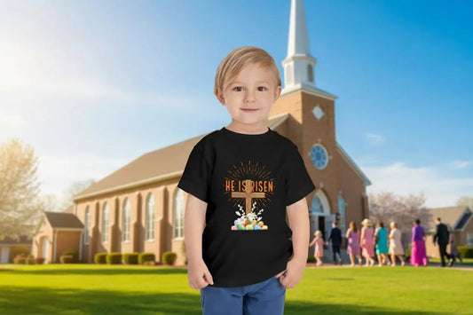 Soft toddler Easter tee with "He Is Risen" cross & pastel eggs. Perfect for church, egg hunts & family photos. Lightweight cotton for comfort & faith. Black