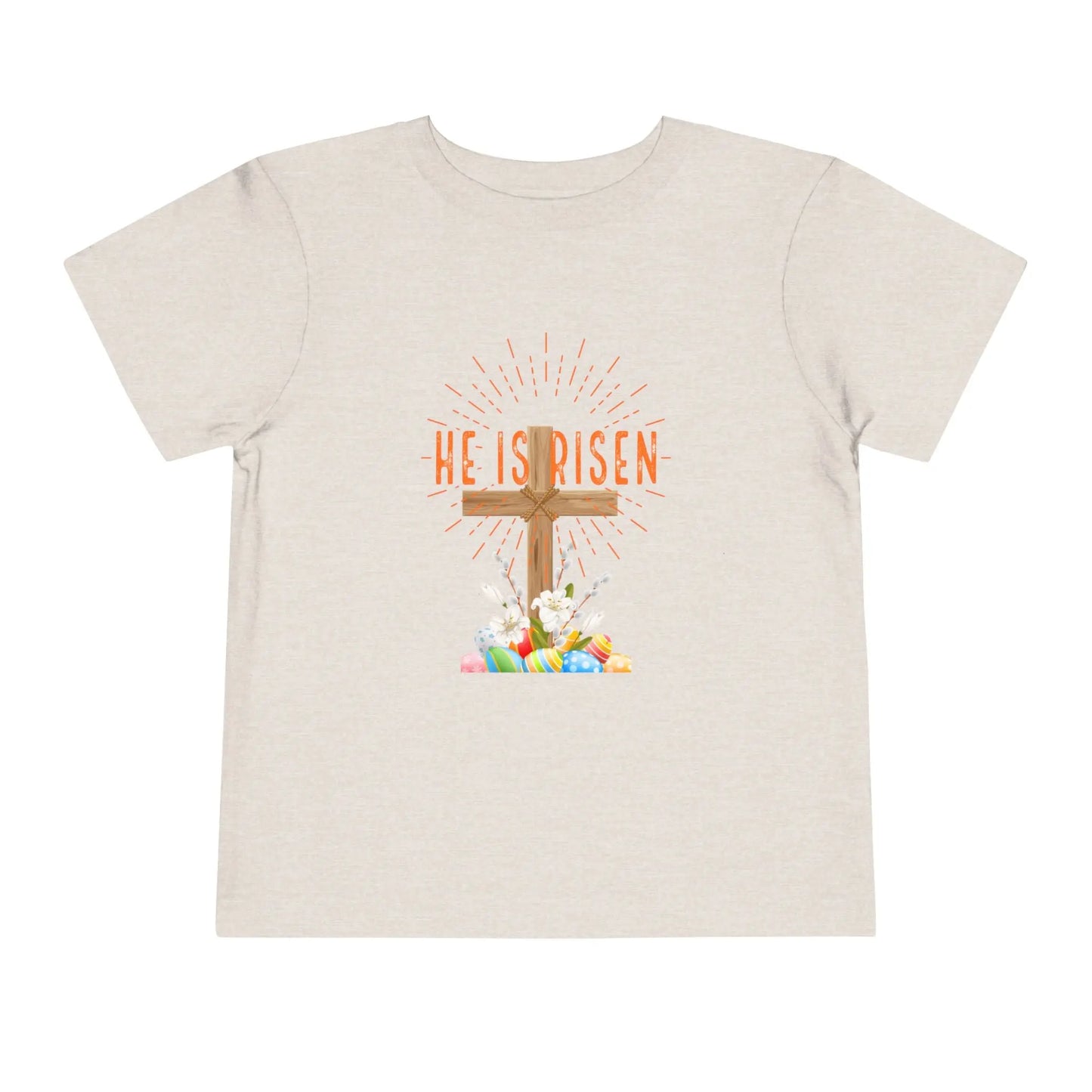 Soft toddler Easter tee with "He Is Risen" cross & pastel eggs. Perfect for church, egg hunts & family photos. Lightweight cotton for comfort & faith. Heather Dust