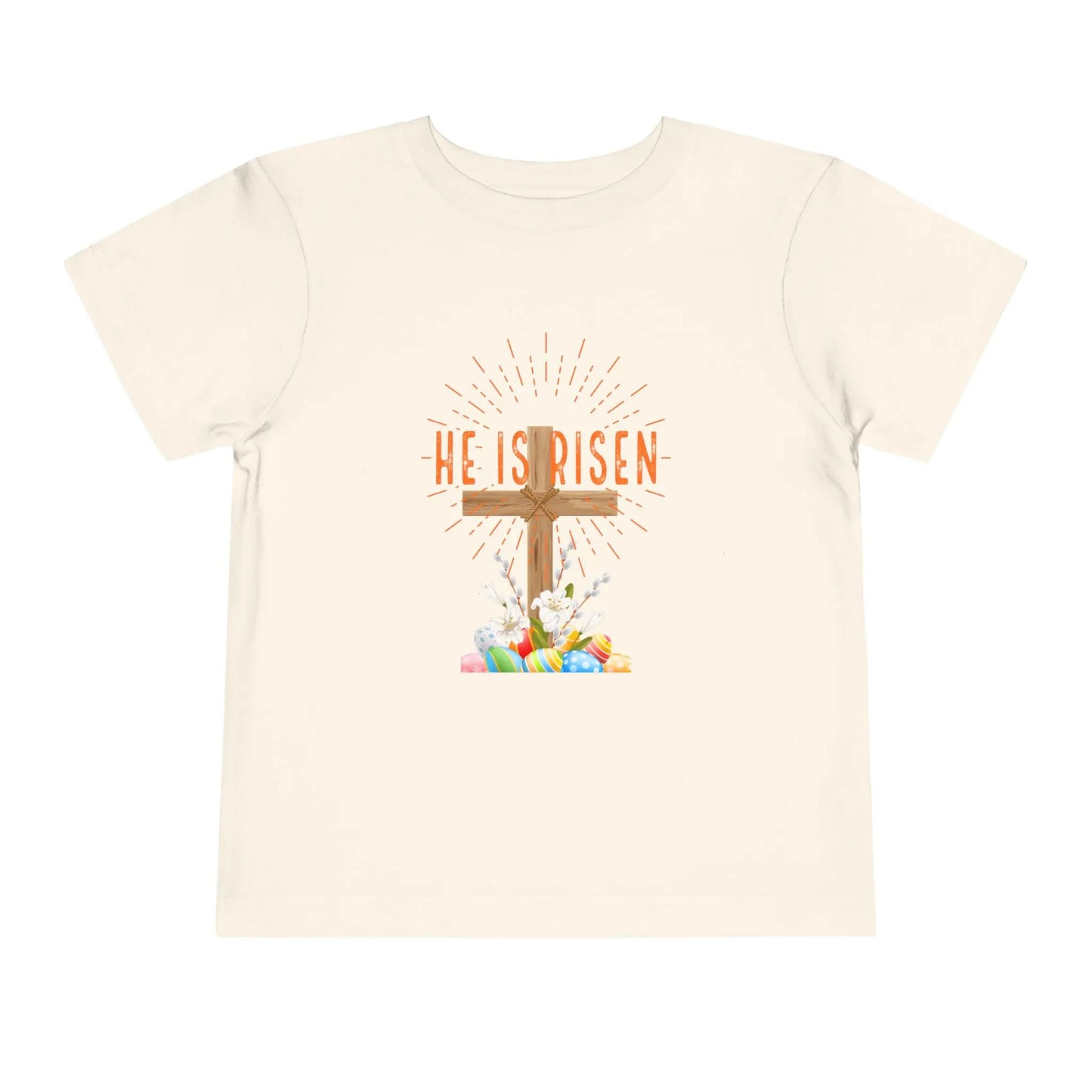 Soft toddler Easter tee with "He Is Risen" cross & pastel eggs. Perfect for church, egg hunts & family photos. Lightweight cotton for comfort & faith. Natural