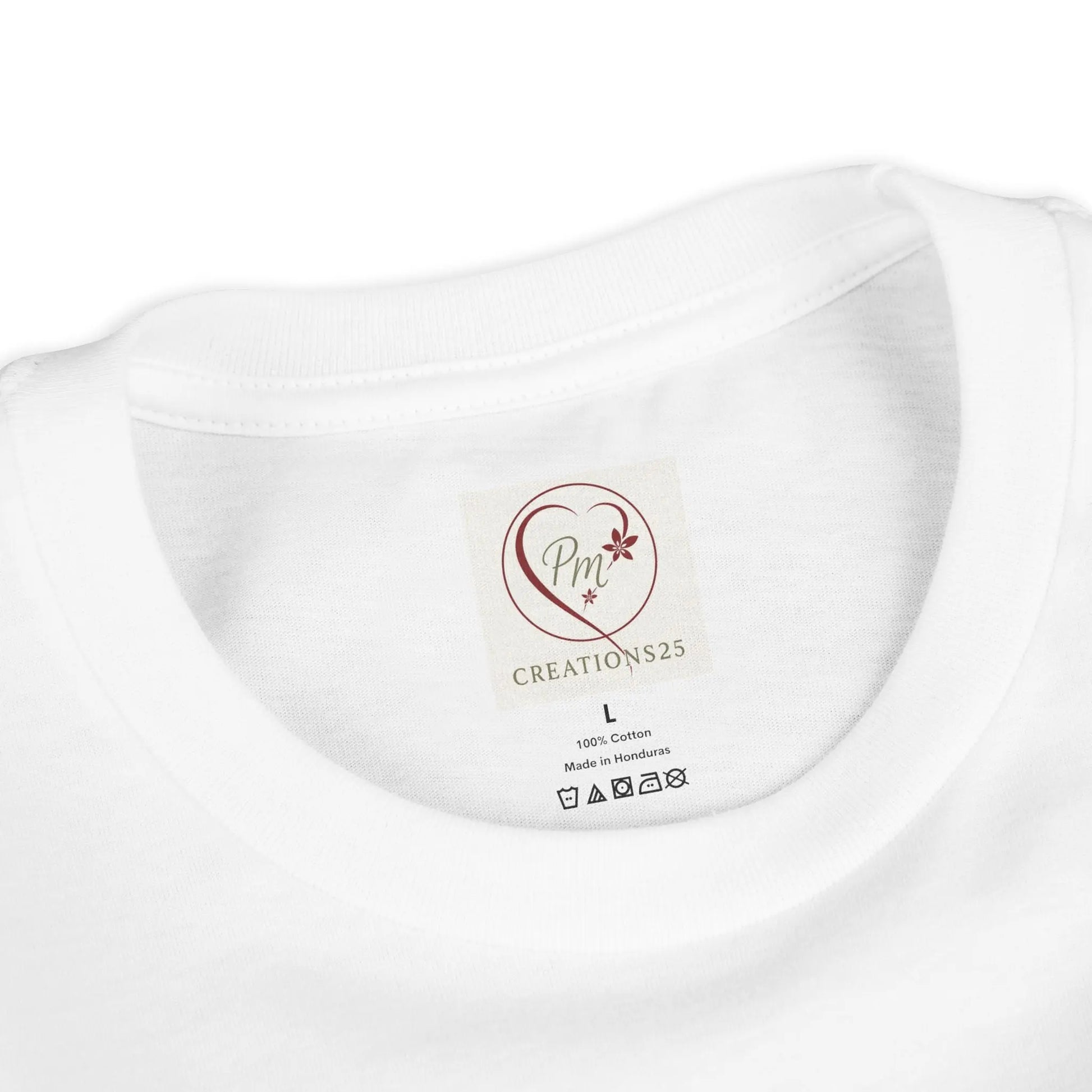 White t-shirt collar with a PM Creations 25 label 