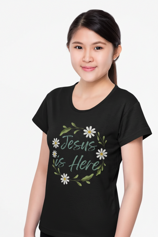 A soft, floral "Jesus is Here" youth Christian tee — a gentle reminder of God's presence for little ones. Perfect for church, Sunday school, baptisms, and everyday faith wear.