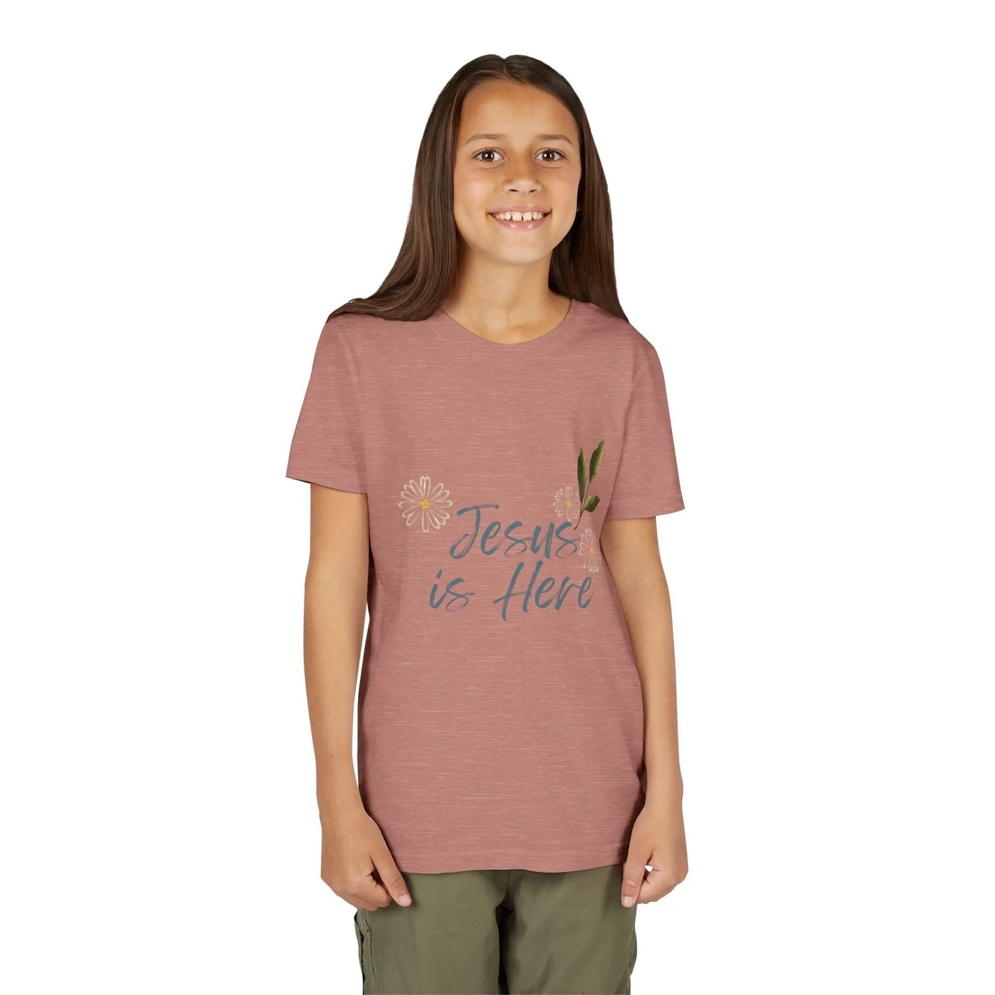 A soft, floral "Jesus is Here" youth Christian tee — a gentle reminder of God's presence for little ones. Perfect for church, Sunday school, baptisms, and everyday faith wear. Heather Mauve
