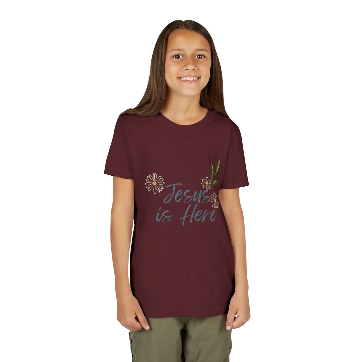 A soft, floral "Jesus is Here" youth Christian tee — a gentle reminder of God's presence for little ones. Perfect for church, Sunday school, baptisms, and everyday faith wear. Maroon