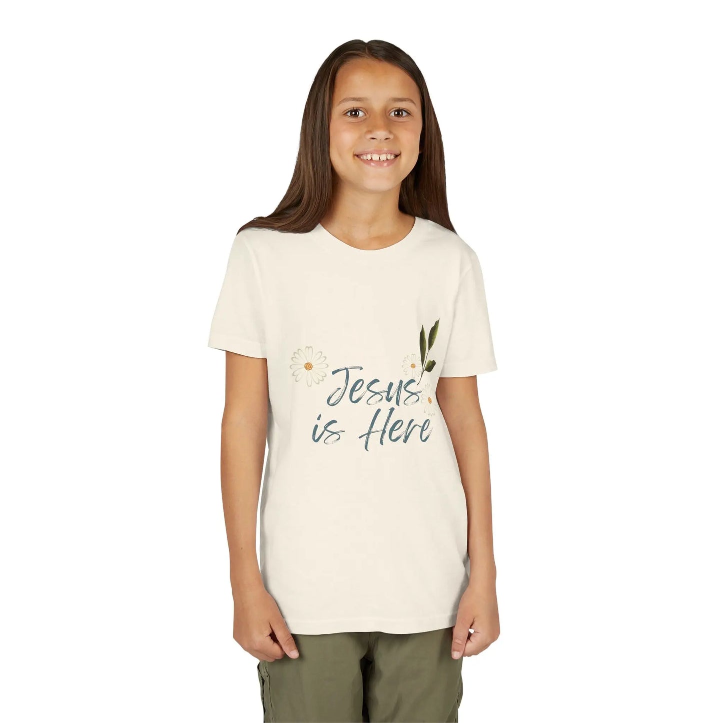 A soft, floral "Jesus is Here" youth Christian tee — a gentle reminder of God's presence for little ones. Perfect for church, Sunday school, baptisms, and everyday faith wear. Natural