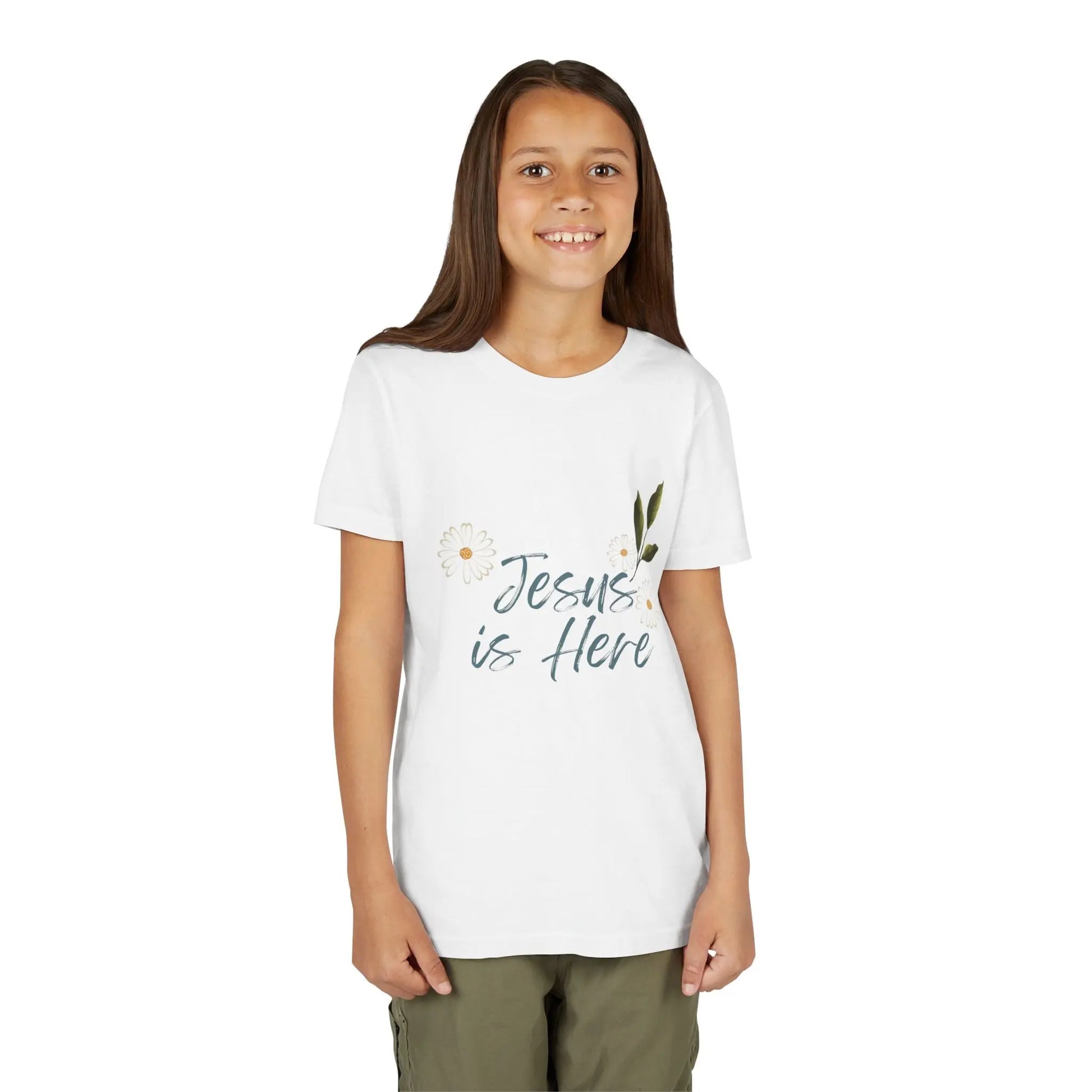 A soft, floral "Jesus is Here" youth Christian tee — a gentle reminder of God's presence for little ones. Perfect for church, Sunday school, baptisms, and everyday faith wear. White