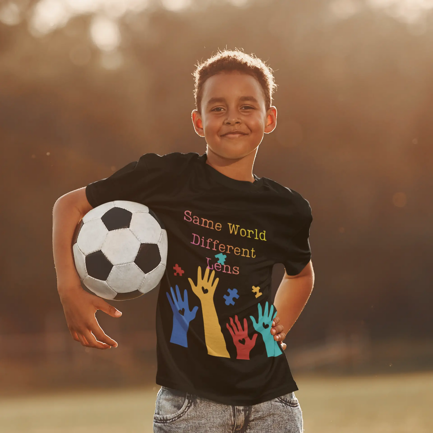 Soft, colorful kids' autism awareness tee celebrating neurodiversity. Features raised hands & puzzle pieces. 100% cotton ethically made. Perfect for autism pride & inclusion.