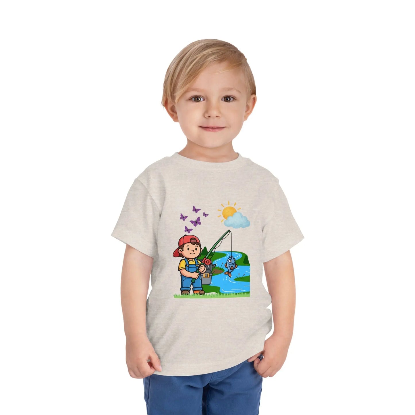 Cute kid fishing toddler tee with a fun outdoor graphic. Soft cotton, sizes 2T–5T. Perfect for little anglers, lake days & nature-loving kids. Heather Dust