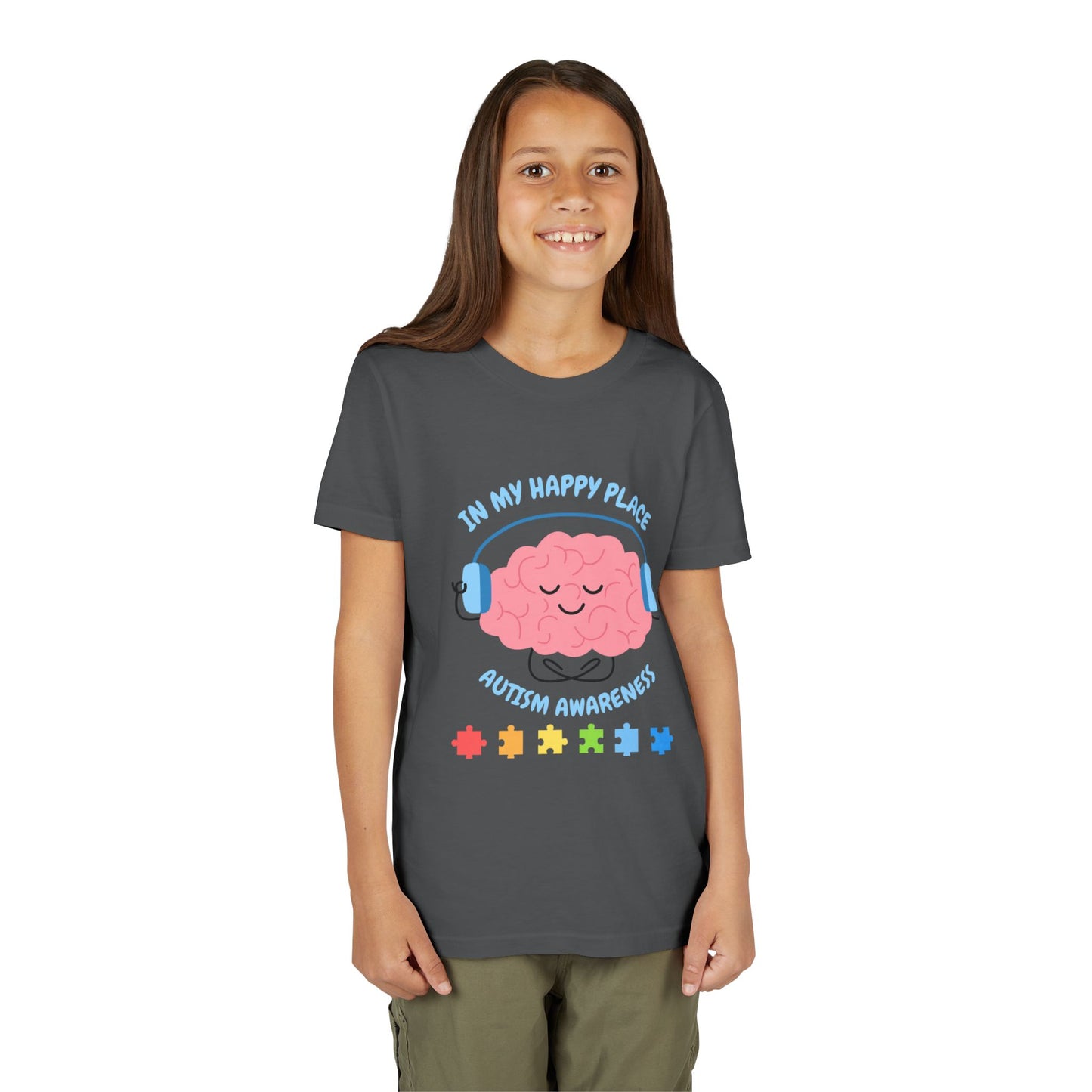 Girl wearing a youth tee for Autism Awareness with smiling brain with headphones and colorful puzzle pieces, "In My Happy Place" graphic.  Dark Heather Grey