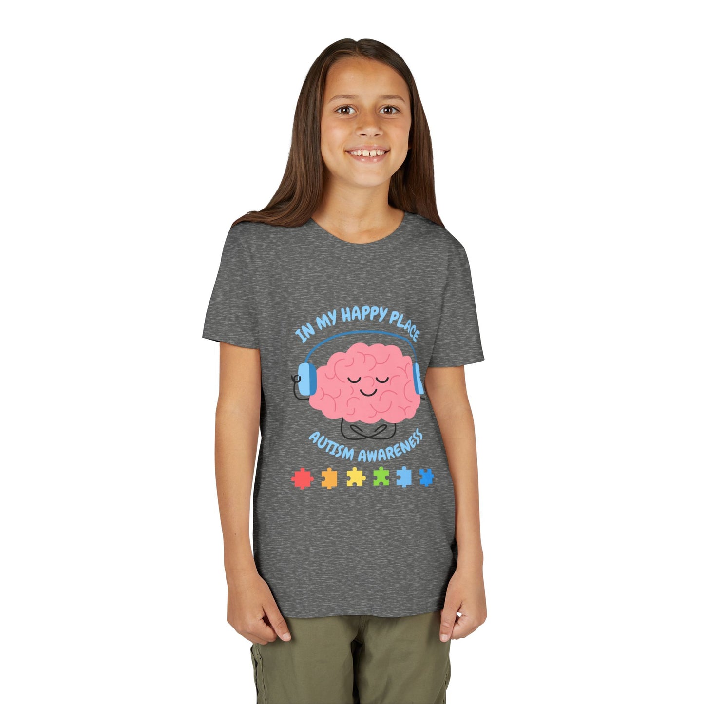 Girl wearing a youth tee for Autism Awareness with smiling brain with headphones and colorful puzzle pieces, "In My Happy Place" graphic. Deep Heather