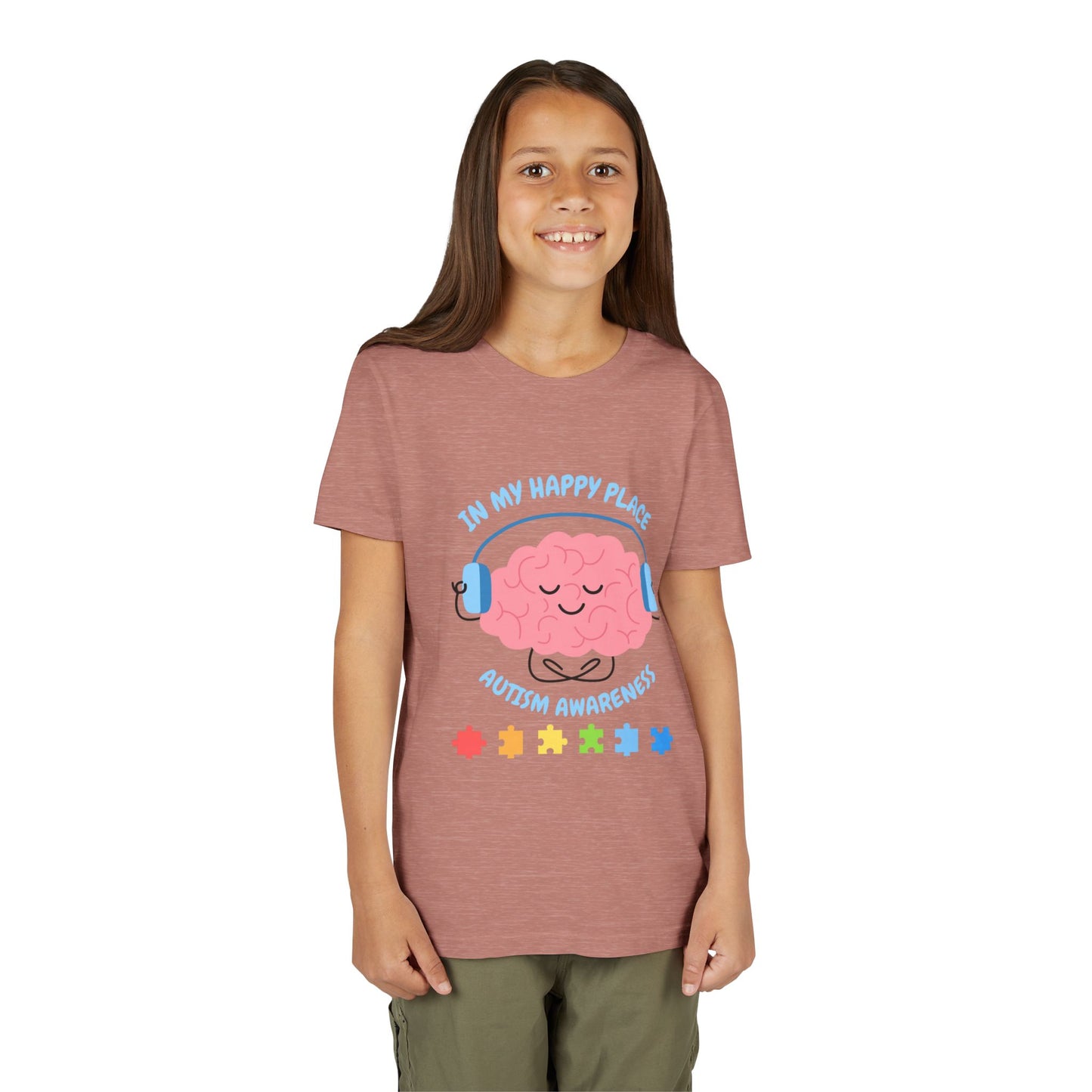 Girl wearing a youth tee for Autism Awareness with smiling brain with headphones and colorful puzzle pieces, "In My Happy Place" graphic. Heather Mauve