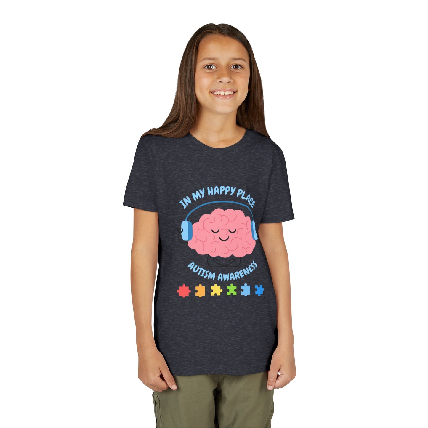 Girl wearing a youth tee for Autism Awareness with smiling brain with headphones and colorful puzzle pieces, "In My Happy Place" graphic. Heather Navy