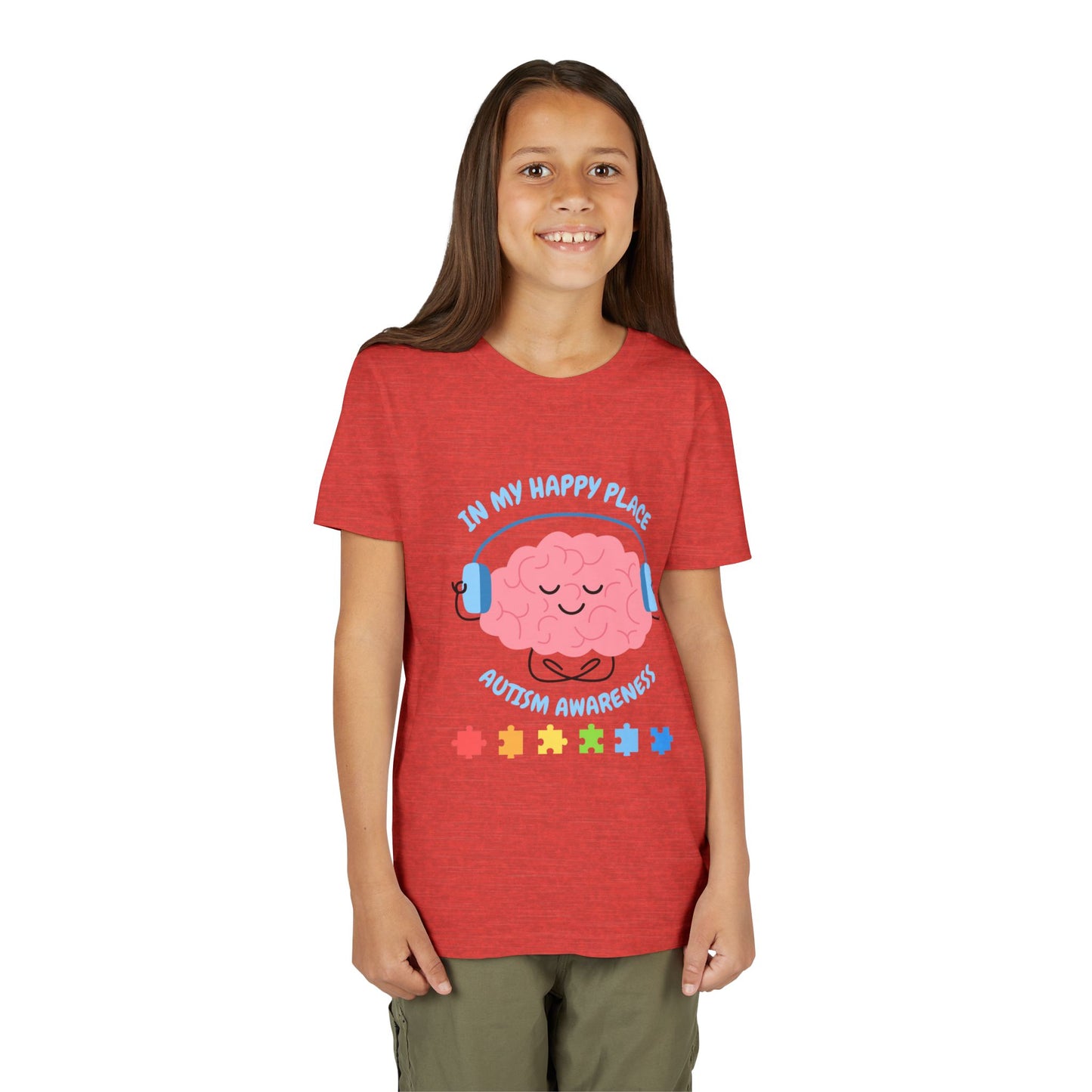 Girl wearing a youth tee for Autism Awareness with smiling brain with headphones and colorful puzzle pieces, "In My Happy Place" graphic. Heather Red