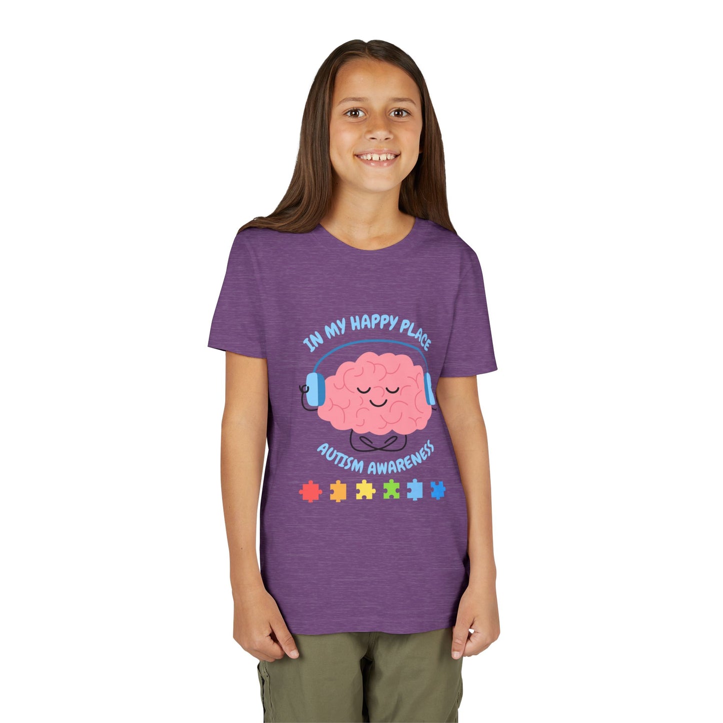  Girl wearing a t-shirt with an Autism awareness youth tee with smiling brain with headphones and colorful puzzle pieces, "In My Happy Place" graphic. Heather Team Purple