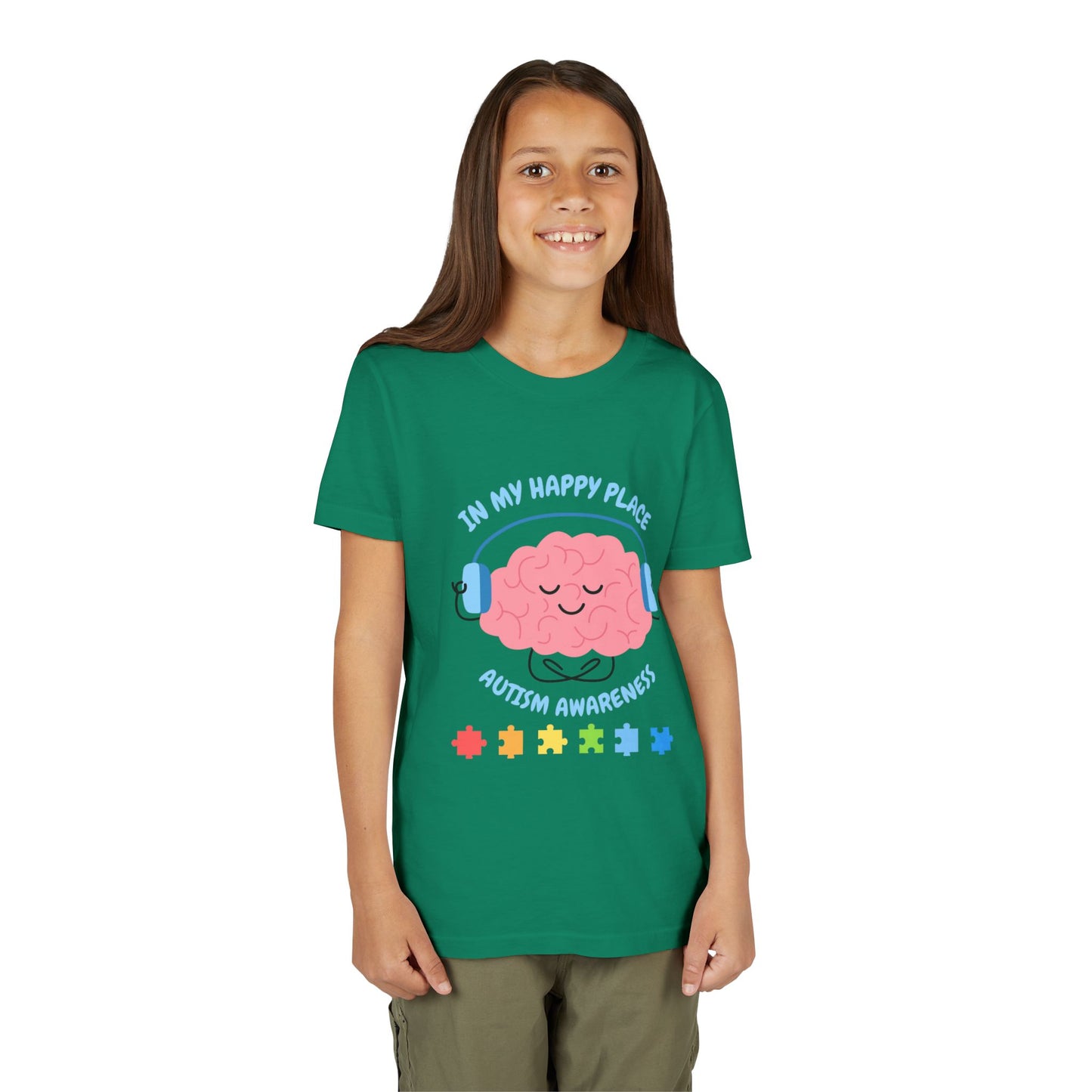 Girl wearing a youth tee for Autism Awareness with smiling brain with headphones and colorful puzzle pieces, "In My Happy Place" graphic. Kelly Green